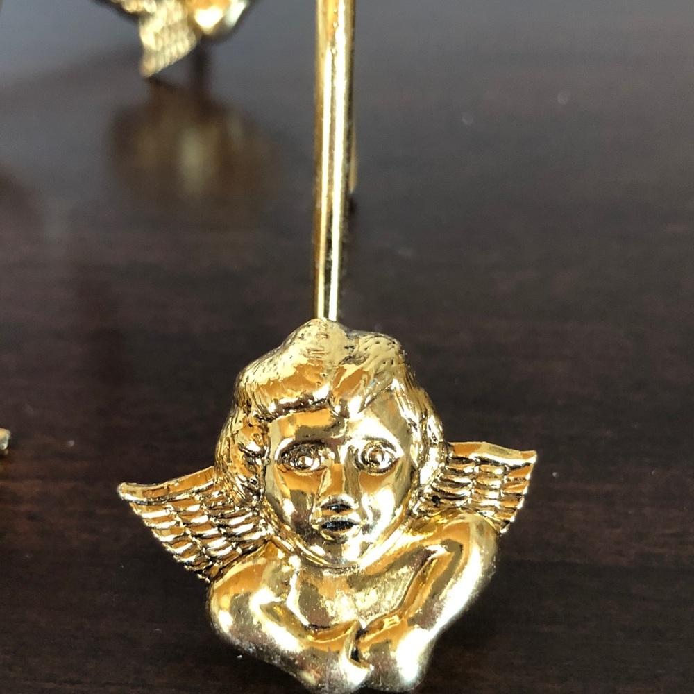 Vintage gold-tone cherub angel shower curtain hooks
